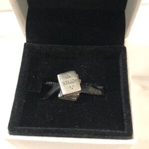 Pandora textbook with owl charm
